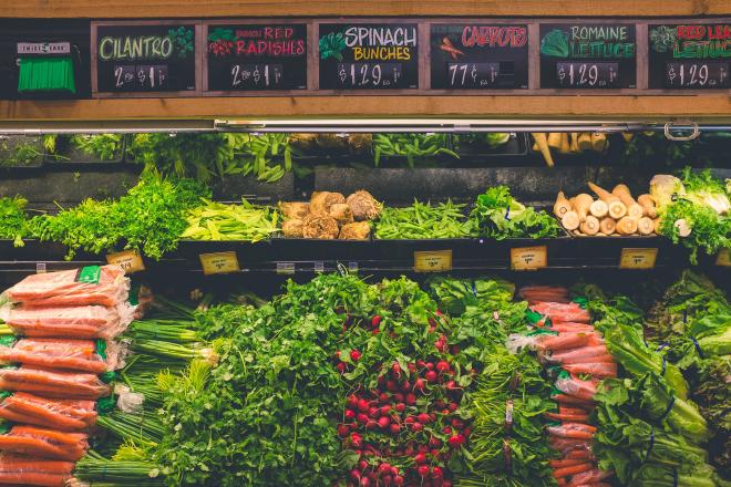 A supermarket shelf with vegetables