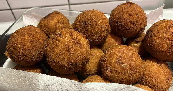 A small mountain of arancini - deep-fried happiness from my point of view.