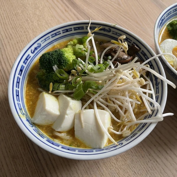 Vegan firecracker ramen with a topping of tofu, broccoli and mushrooms. (Edited with Nano Banana.)