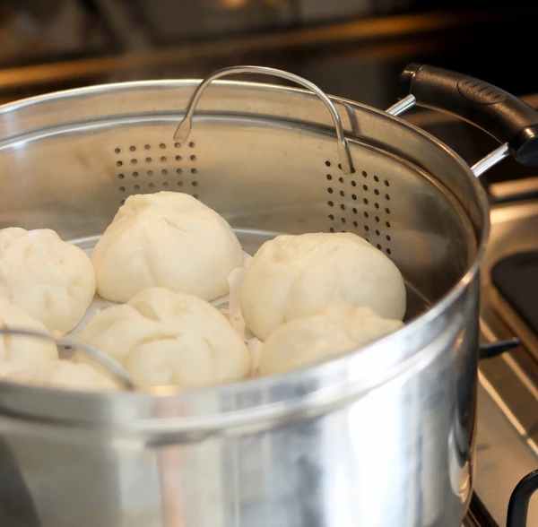 Steamed baos. Photo by Joan Tran