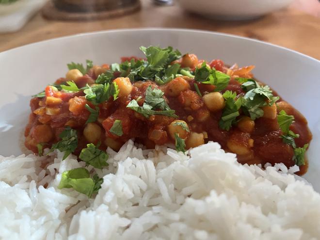 Chana masala with rice and coriander.