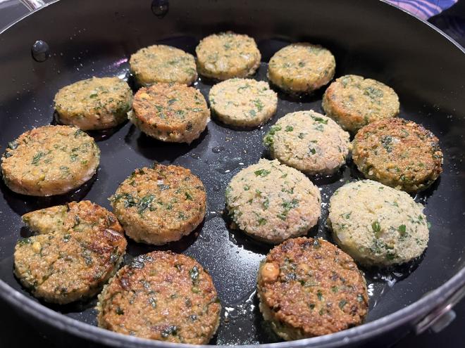 Falafel are fried in a pan