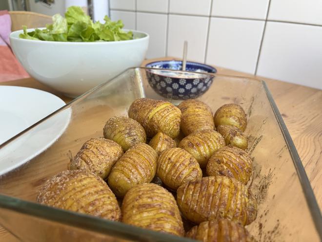 Hasselback potatoes with tomato aioli and salad