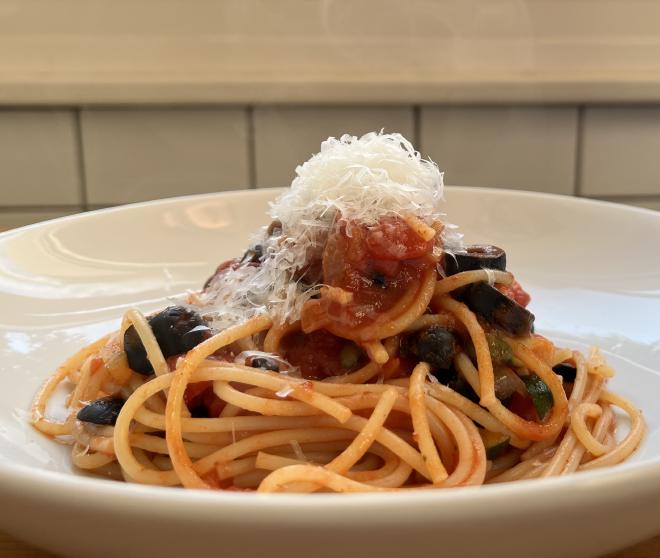 Pasta with harissa tomato sauce, capers and olives