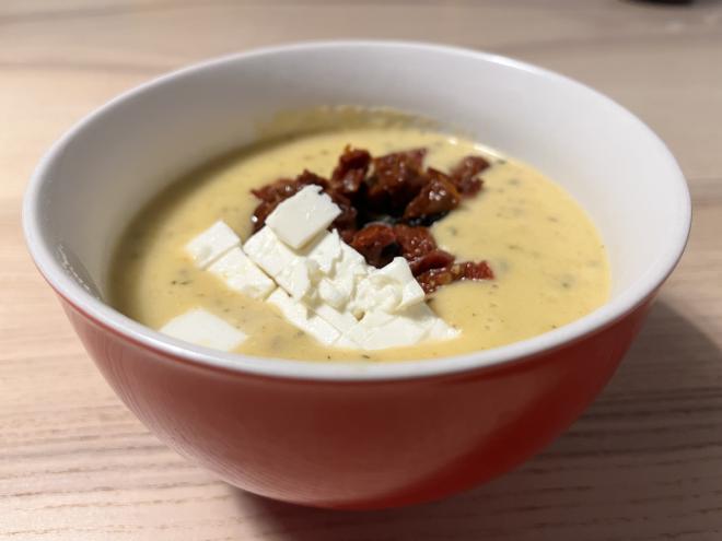 A bowl of potato soup from Provence, garnished with a little feta and dried tomatoes